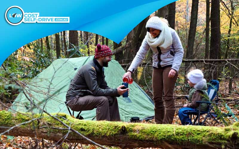 thumbnail man setting up camp with his kids, camping trip, Christmas Towns
