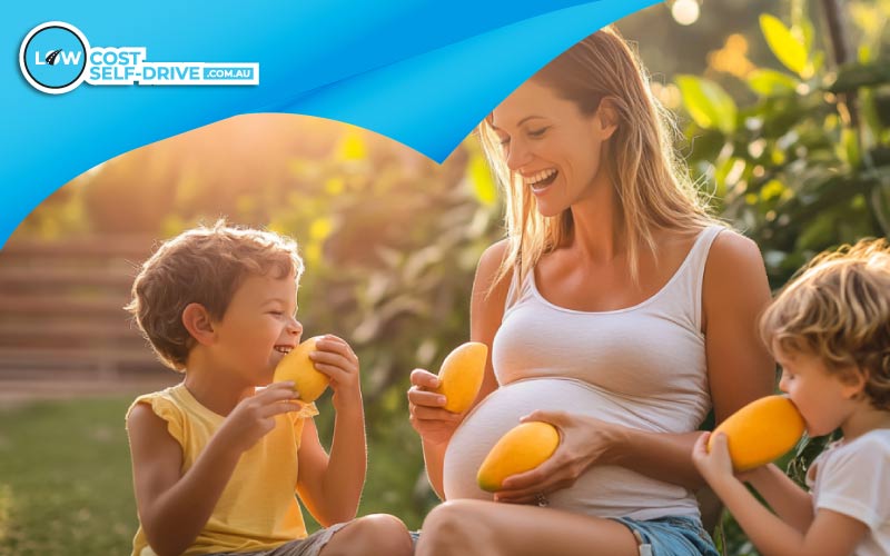thumbnail mum enjoying Aussie mangos with her kids, Christmas trip, Unique Christmas Specialties
